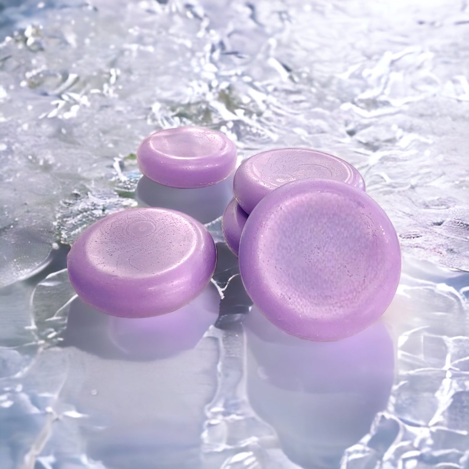 three purple conditioner bars floating in a pool of water